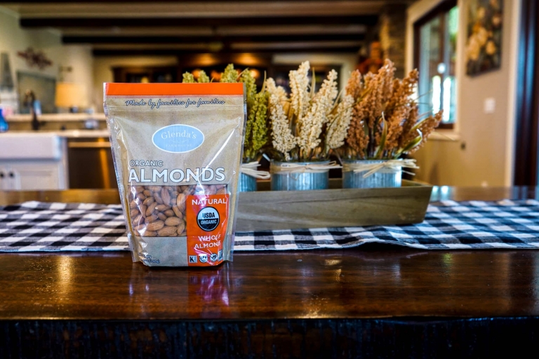 A bag of organic almonds sits on a table.